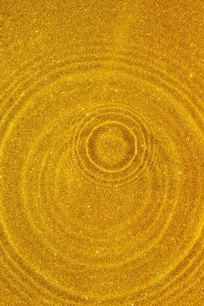 Golden glitter circles abstract background, golden glitter texture
