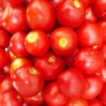 a pile of red tomatoes