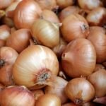 white garlic on brown wooden table
